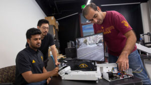 Mohammad Farhadi (left), MORE student Manthan Chelenahalli Satish (center) and Assistant Professor Yezhou “YZ” Yang (right).